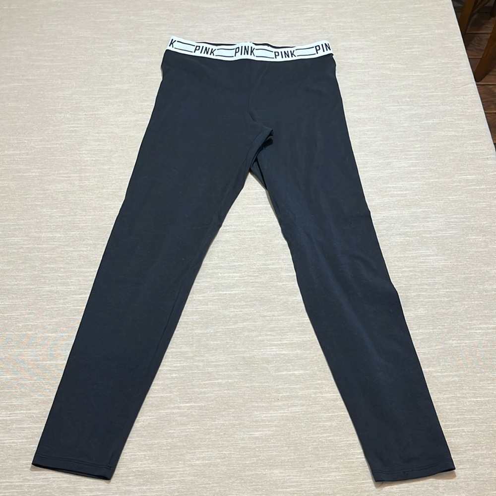 Pink Victoria’s Secret black legging or yoga pants with white waist band. Size M